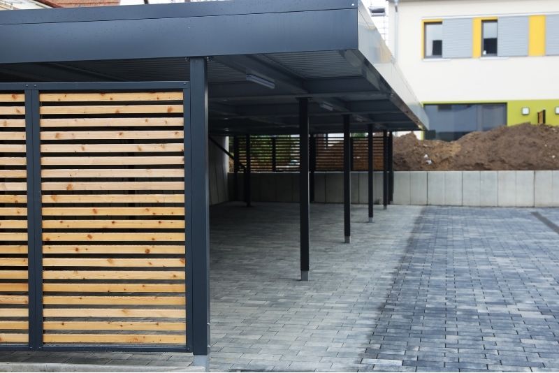 Metal frame carport structure with timber siding. This job was perform by Newcastle Pergolas