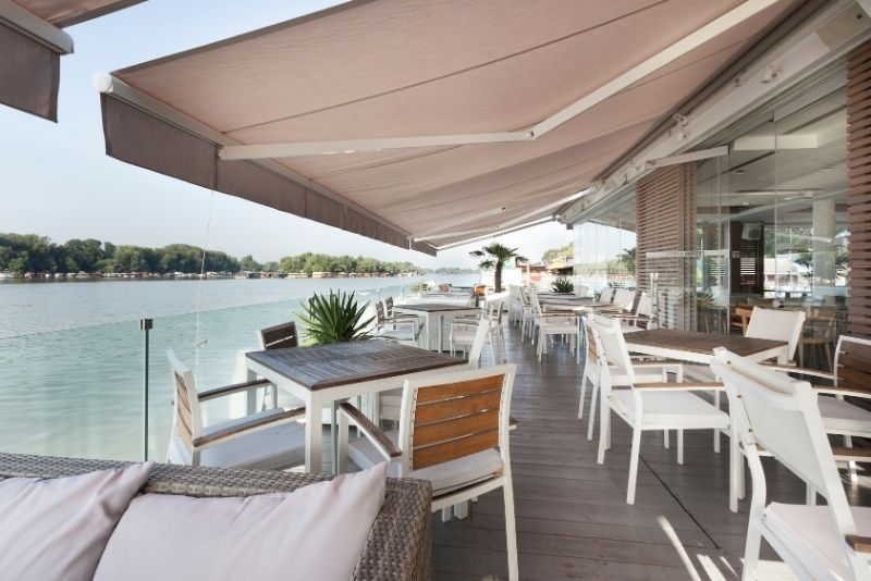 restaurant by the sea covered with awnings