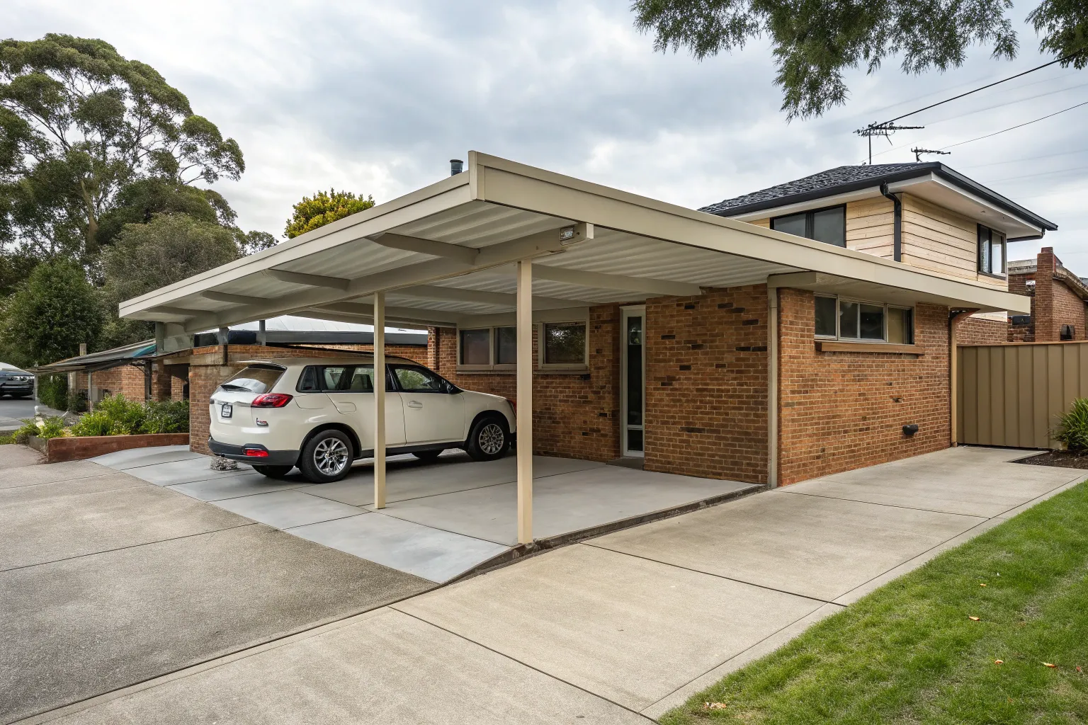 Tandem double carport attached to a brick home